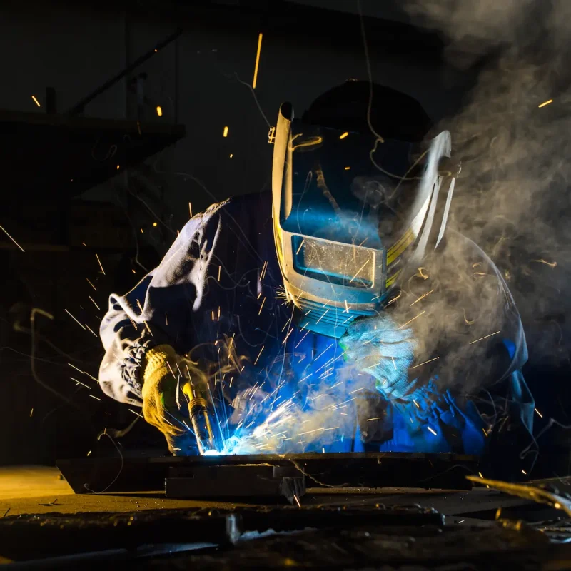 welding-manufacturing-electric-welder-working-with-argon-welding-mask-while-working-detail